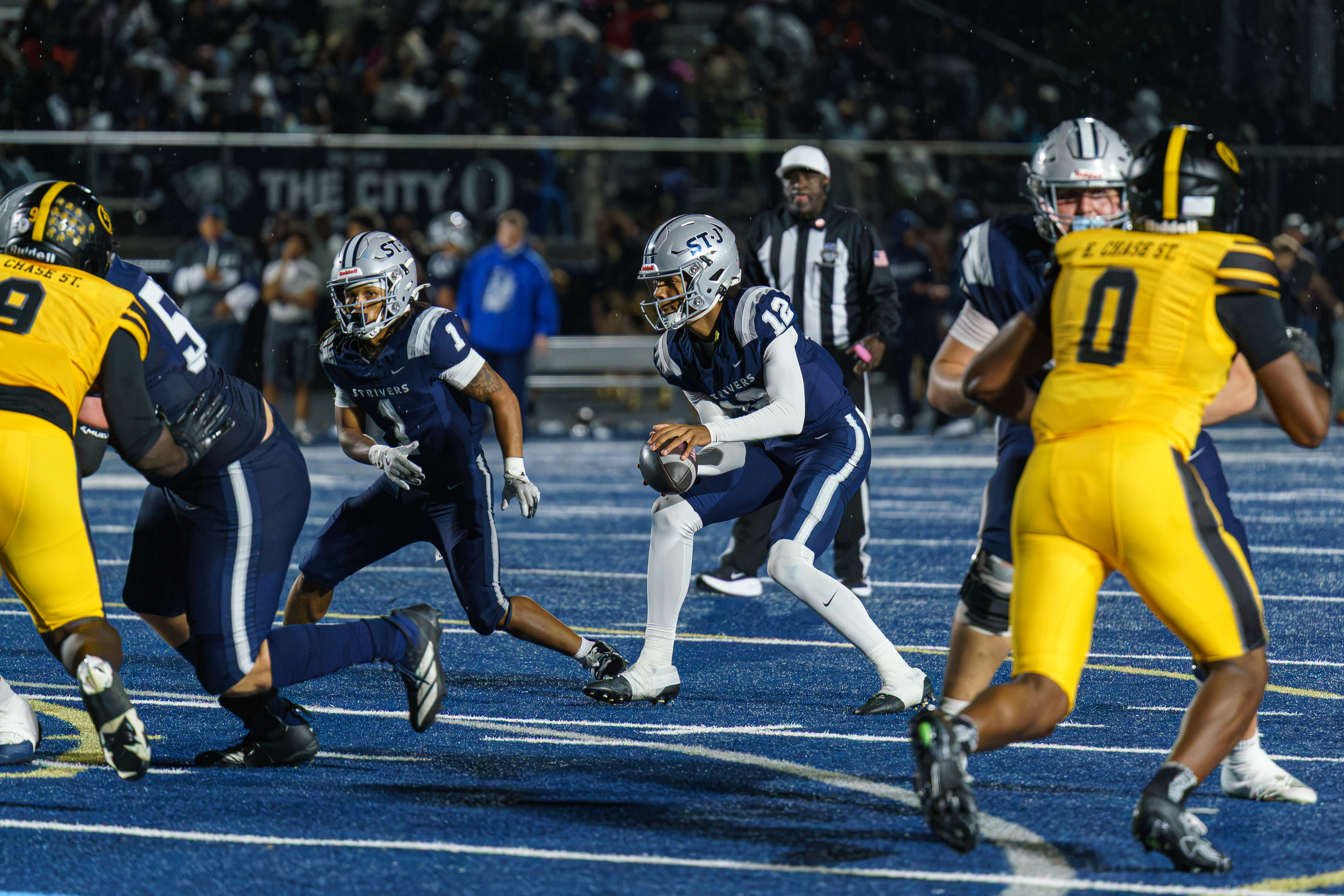 A St. James player carries the football during the game against St. Frances.